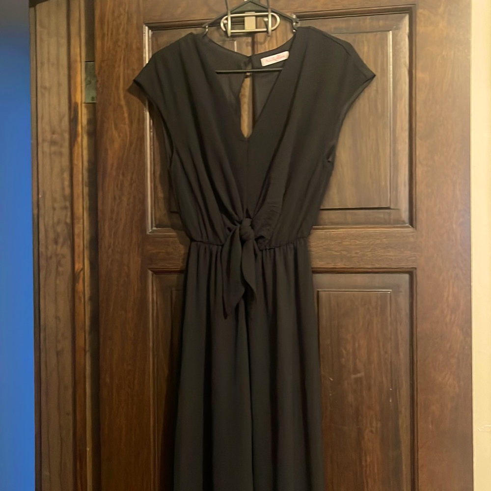 Long black romper (pant style) with tie knot detail in front & open back -size S